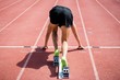 © WavebreakMediaMicro - Rear view of an athlete ready to run