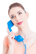 Portrait of young attractive woman holding telephone receiver