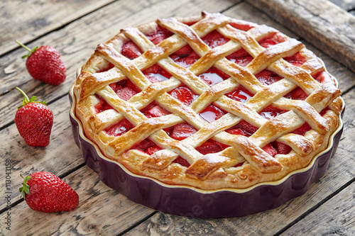 Fotografia, Obraz Baked strawberry pie cake sweet pastry on rustic wooden table background