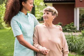 Wall Mural - Carer and patient relaxing outdoor