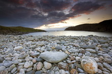 Looking Out To Sea At Sunset Across The Rocky Beach At Gearranin, Isle Of Lewis, Outer Hebrides, Scotland