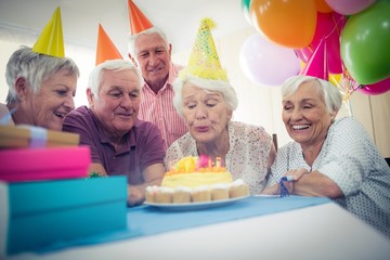 Wall Mural - group of seniors celebrating a birthday