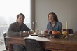 © fStop - Couple having breakfast at dining table, portrait