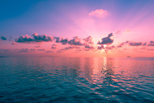 Magnificent Panorama Of Sunset Over The Ocean. Rays Of The Sun Shine Through The Clouds.