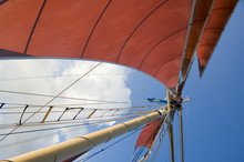 Red Sails On Sailboat That Takes Tourists Out For Sunset Cruise, Key West, Florida