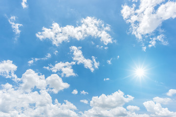 Wall Mural - Blue sky with clouds and sun reflection