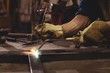 © Wavebreak Media - Close up of male welder using blowtorch in workshop