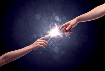 Hands reaching to light a spark