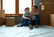 © lenets_tan - Portrait of young couple moving in new home