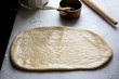 © Andrew Scrivani - White bread dough rolled out on work surface