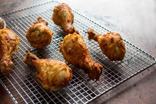 Fried Chicken Drumsticks On Cooling Rack