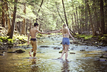 Couple walking in river