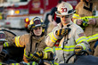 © Cavan Images - Firefighter talking on two way radio outdoors