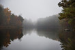 © Cavan Images - View of lake on foggy day