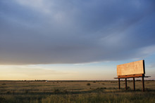 View Of Abandoned Billboard In Field