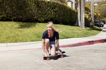 Young Woman On Skateboard