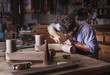 © Cavan Images - Carpenter working in workshop