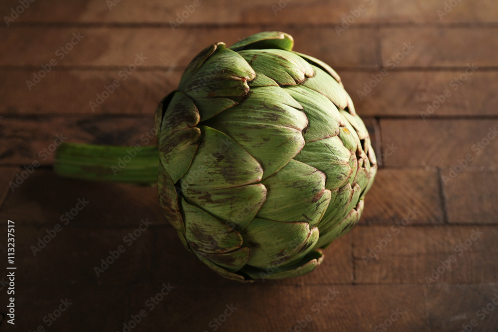 Artichokes on wooden background