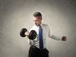 Businessman lifting weights
