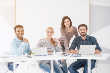 Sticker - Group of young colleagues having meeting at office