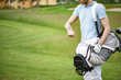 © Yakobchuk Olena - Young golfer checking time on smartwatch