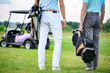 © Yakobchuk Olena - Two partners of game standing on golf course
