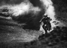 Motocross Racer Accelerating In Dust Track, Black And White Photo