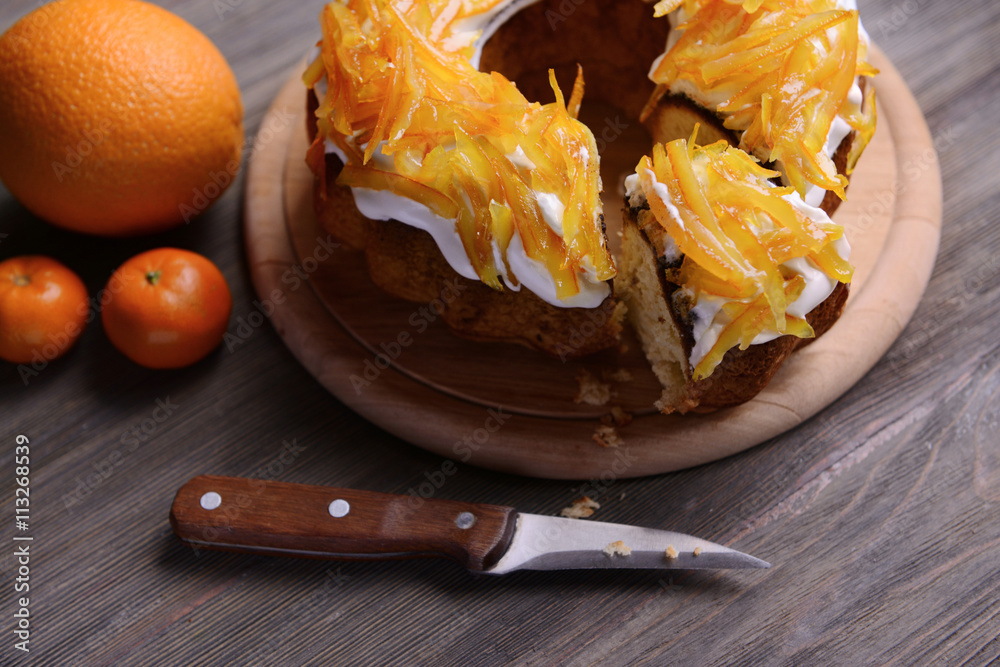 Delicious citrus cake on wooden background