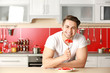 © Africa Studio - Man and healthy food in kitchen