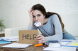 © Wordley Calvo Stock - young woman asking for help suffering stress doing domestic accounting paperwork bills
