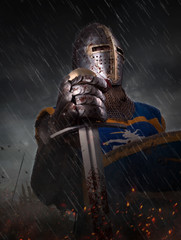 A knight with sword under the rain on battlefield.