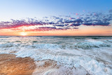 Fototapeta Natura - Colorful ocean beach sunrise.