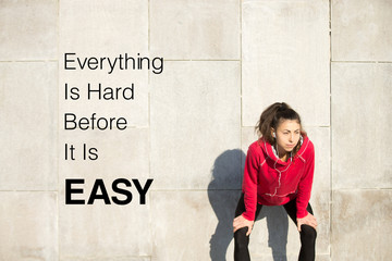 Woman resting after running. Motivational phrase 