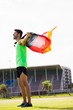 © WavebreakMediaMicro - Athlete posing with german flag after victory