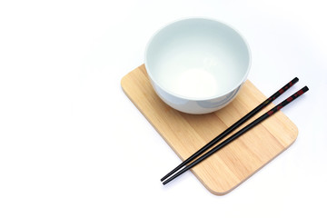 chopstick, cutting board and cup on white background