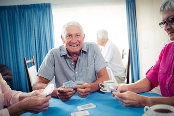 Wall Mural - group of seniors playing cards