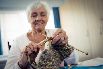 Wall Mural - Senior woman sewing 