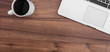 © eightstock - Desk with open laptop, and coffe