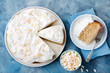 © annapustynnikova - Three milk cake, tres leches cake with coconut. Traditional dessert of Latin America Top view