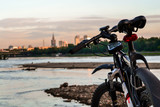 Fototapeta  - Bike on a city landscape background
