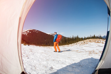 Wall Mural - Hiker in winter mountains.