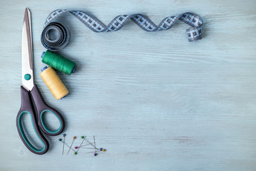 still life of spools of thread on a wooden background