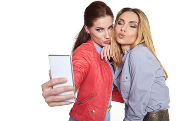 Sticker - Two women friends taking selfie with smartphone.