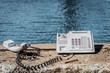 No service,View of an old phone ,sea background