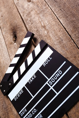 photo of movie clapper on wood