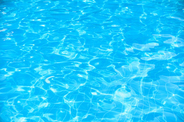 ripple water surface and sun reflection in swimming pool