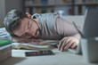 © stokkete - Sleepy young man at desk