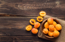 Fresh Organic Apricots In Wooden Bowl