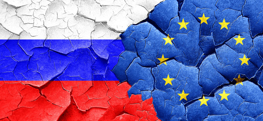 Russia flag with european union flag on a grunge cracked wall