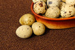 quail eggs in an earthenware dish